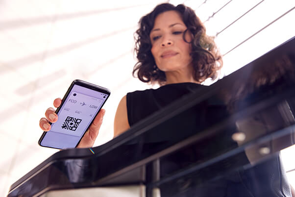 business traveller using mobile boarding pass