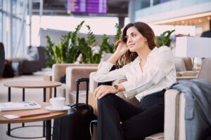 Traveller relaxes in lounge during airport transit
