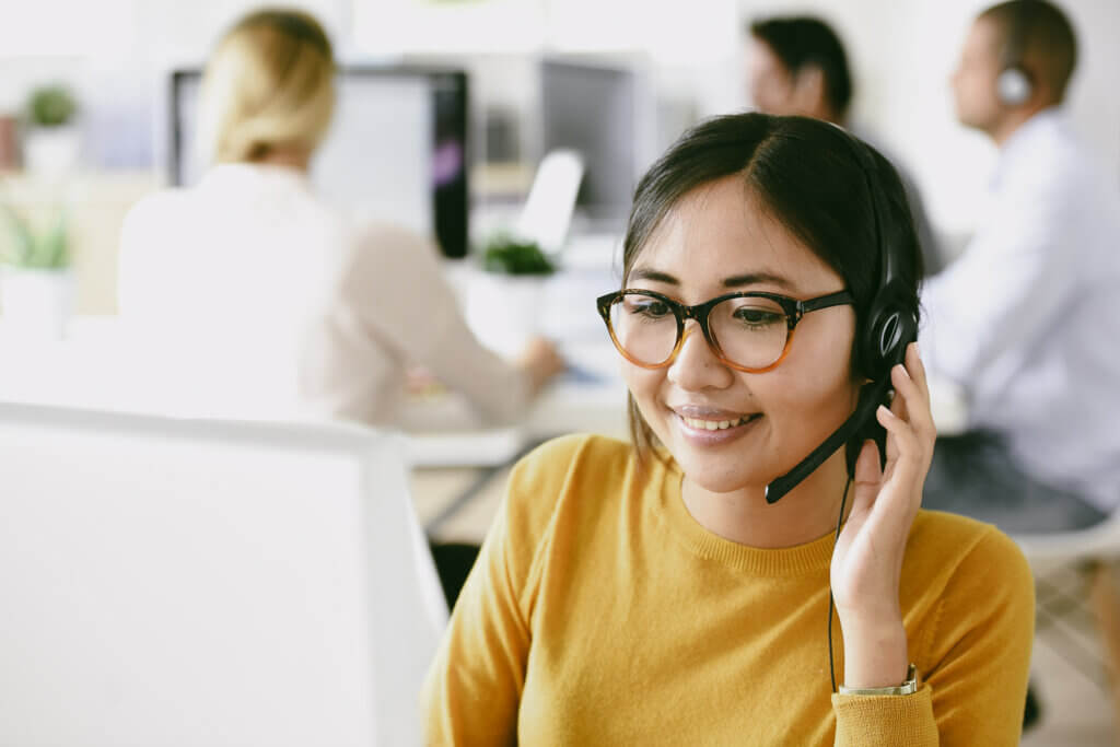 travel agent answers call from travel booker to assist with trip detailss