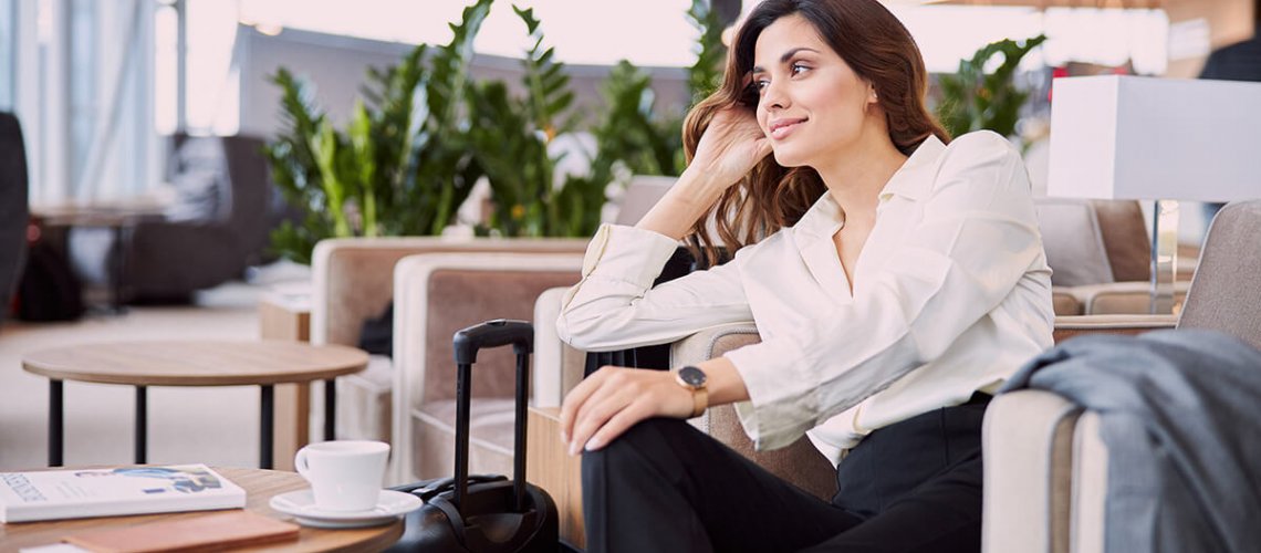 Traveller relaxes in lounge during airport transit